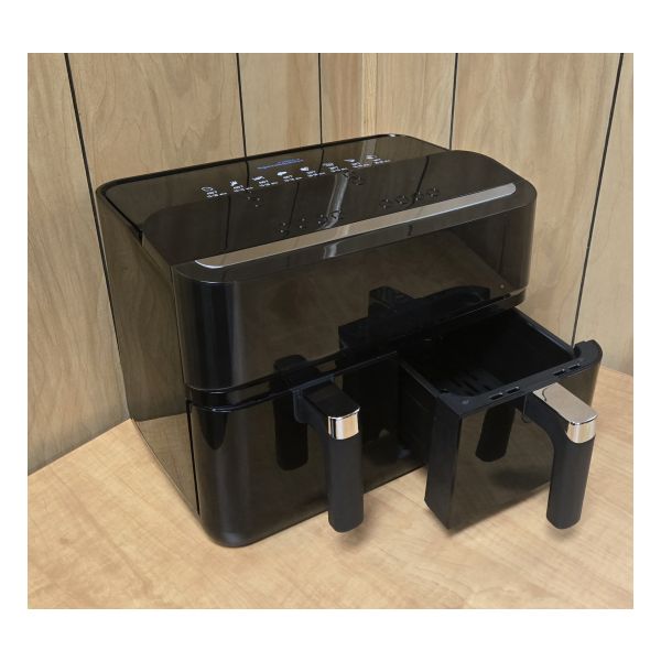The black Cobolt Speechmaster air fryer with tactile buttons and two side-by-side drawers. Auto cook buttons are visible on top of device.