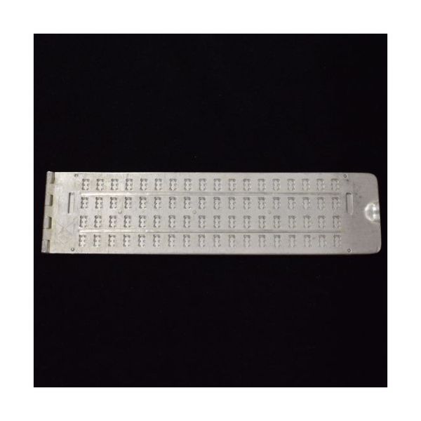 A 4-line aluminum slate with 18 cells per line and a Dymo tape slot at each end.