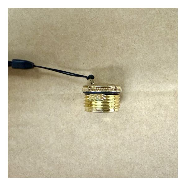 Close up of gold plastic threaded screw-on cap.